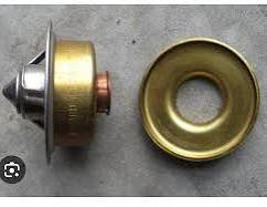 cleveland thermostat and restrictor plate.jpeg